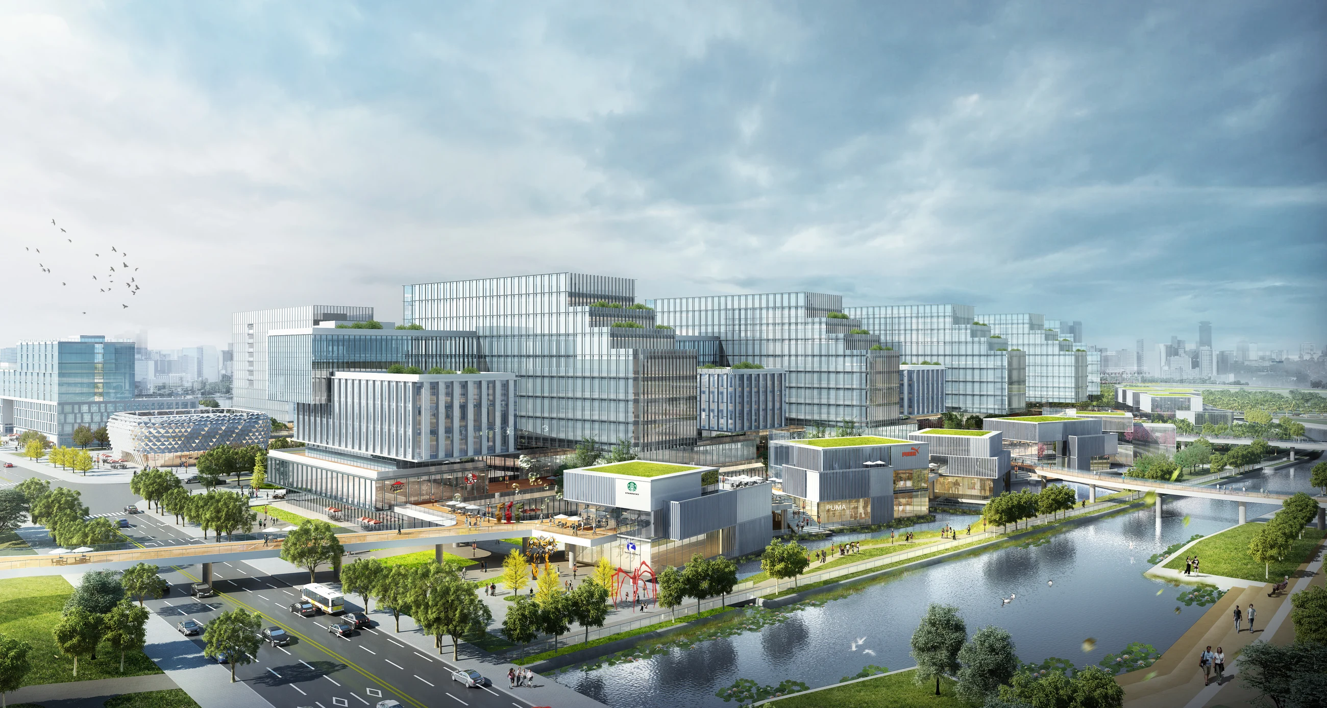 Innovation campus buildings and public paths along a restored waterway